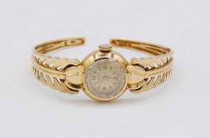 Orologio da signora con bracciale rigido in oro 750, Baume & Mercier